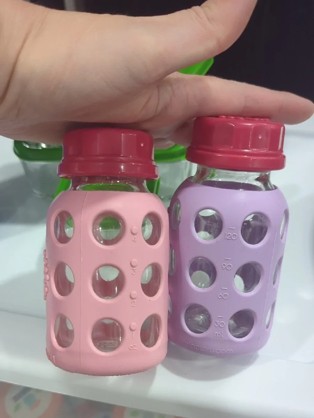 Glass Food Storage Set with Green Lids and Assorted Silicone Bottles